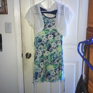 a blue green dress with a short white cardigan